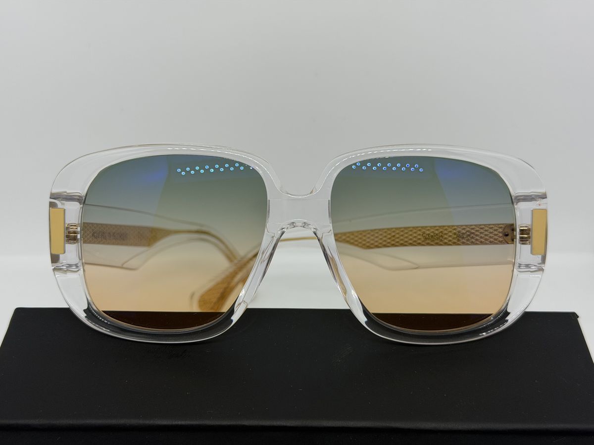 Transparente Sonnenbrille von Alfred Kerbs mit goldenen Bügeln